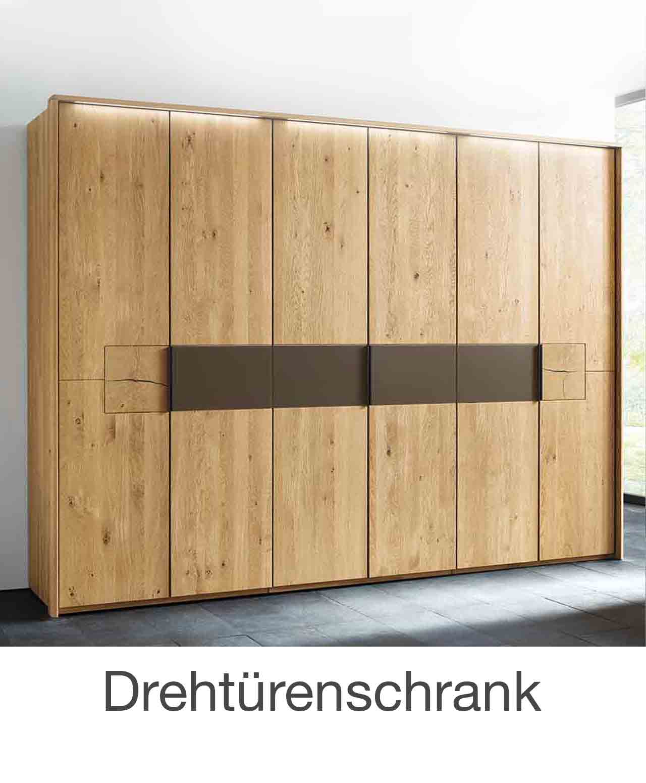 Drehtürenschrank WSM 1600 Drehtürenschrank 2-türig bis 7-türig, in Wildeiche massiv mit Mattglas cubanit Akzent banderole mittig und Hirnholz Applikation.